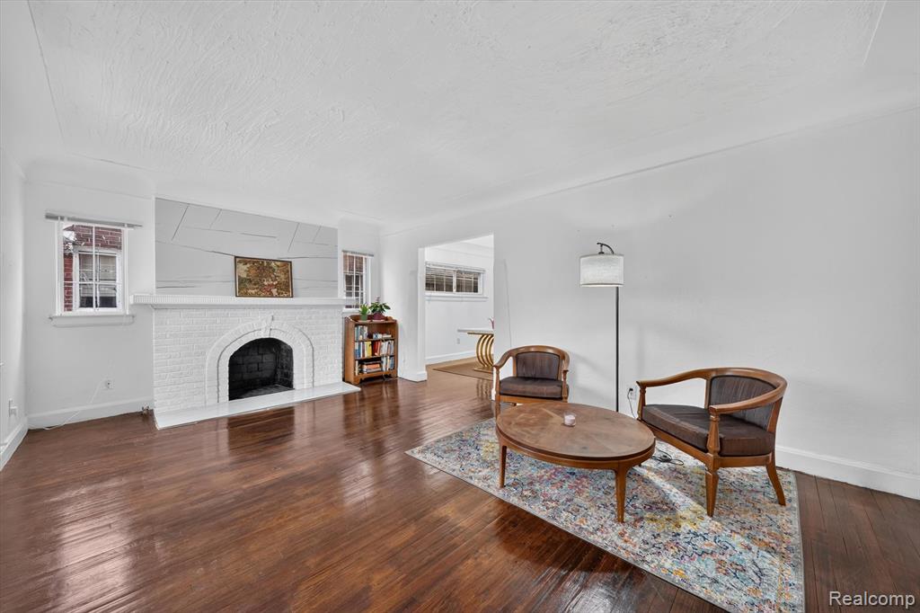 Living room with hardwood floors and fireplace at 19178 San Juan Dr